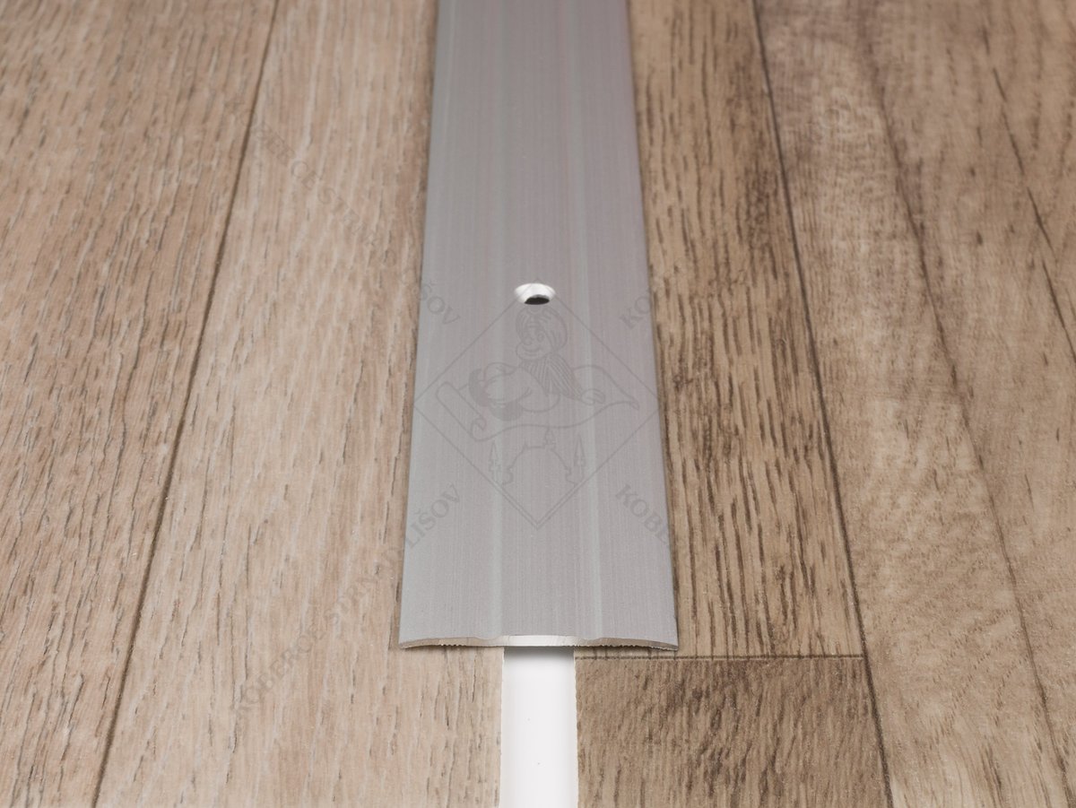 Plochá přechodová lišta 38 mm stříbrná vrtaná šroubovací
