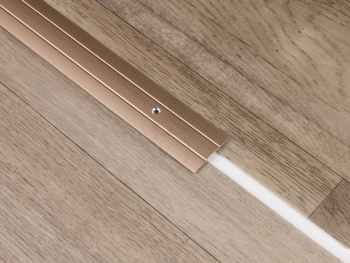 Plochá přechodová lišta 24,5 mm světlý bronz vrtaná šroubovací